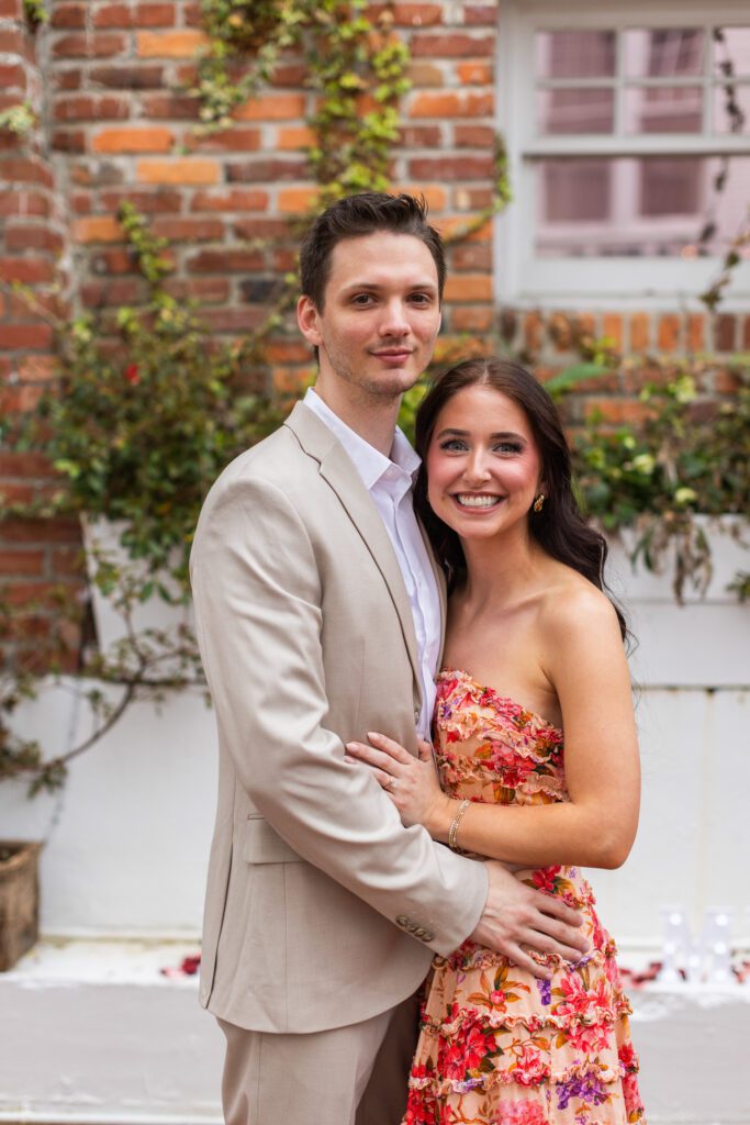 Couple hugging right after the proposal at The Partridge Inn